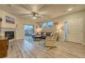 Inviting living room featuring a fireplace and a sliding door to the outside at 24806 E Calhoun Pl # A, Aurora, CO 80016