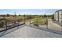Wide-angle view of balcony with woven floor tiles, and iron railing with scenic views of the neighborhood at 1238 N Tennyson St, Denver, CO 80204