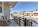 Welcoming front porch with views of a quiet street lined with similar homes at 11400 W Grand Ave, Littleton, CO 80127