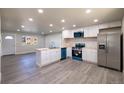 Modern kitchen with stainless steel appliances and island at 5341 Granby St, Denver, CO 80239