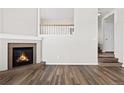 Living room with fireplace and staircase to upper level at 2946 Central Park Blvd, Denver, CO 80238