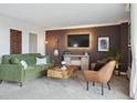 Comfortable living area featuring plush seating, a modern entertainment center, and chic decor at 1250 N Humboldt St # 1504, Denver, CO 80218