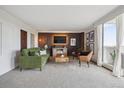 Cozy living room featuring stylish furniture, modern decor, and access to a private balcony at 1250 N Humboldt St # 1504, Denver, CO 80218