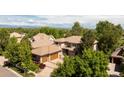 Expansive home situated among lush trees; featuring a spacious yard and spectacular mountain views at 2535 W 115Th Dr, Denver, CO 80234