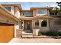 Elegant home featuring a brick facade, well-manicured landscaping, a spacious entryway, and three car garage at 2535 W 115Th Dr, Denver, CO 80234