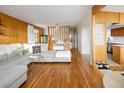 Spacious living room with hardwood floors, a comfortable gray sofa, and stylish decor at 6080 S Detroit St, Centennial, CO 80121