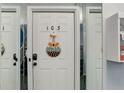 Apartment door number 103 with autumn decor at 7201 E Quincy Ave # 103, Denver, CO 80237