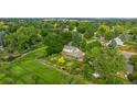 Expansive aerial view of a beautiful home with lush greenery, mature trees, and meticulous landscaping at 3450 E Easter Ave, Centennial, CO 80122