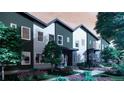 Modern townhomes with landscaped yards and inviting entrances in a residential neighborhood at 81 N Meade St, Denver, CO 80219
