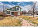 Attractive exterior showcasing brickwork, siding, and a curved walkway leading to the entrance at 375 Aspenwood Ct, Lafayette, CO 80026