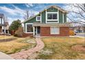 Beautiful home with a combination of brick and siding, complemented by a stone walkway at 375 Aspenwood Ct, Lafayette, CO 80026