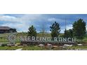 Stone monument sign for Sterling Ranch community showcasing manicured landscaping and inviting entrance at 9279 Merino Ct # B, Littleton, CO 80125