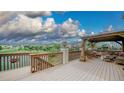 Spacious deck with pergola, scenic views, and comfortable outdoor seating area at 9832 N Crystal Lake Dr, Littleton, CO 80125