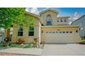 Inviting exterior showcasing a well-maintained yard and attached two car garage at 9832 N Crystal Lake Dr, Littleton, CO 80125