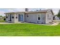 Spacious backyard with lush green lawn and a concrete patio, perfect for outdoor enjoyment at 8481 Uinta St, Commerce City, CO 80022