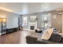 Comfortable living room with a modern fireplace and lots of natural light at 2415 E 110Th Dr, Northglenn, CO 80233