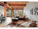 Spacious living room features large windows, hardwood floors, modern decor, and comfortable seating at 2955 Inca St # 2D, Denver, CO 80202