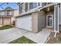Home with a two-car garage, well kept yard and a front porch with a 