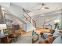 Comfortable living room features modern decor, hardwood floors, and an open staircase at 4144 Tennyson St # 212, Denver, CO 80212