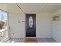 Close-up of the front door with a welcome mat at 575 2Nd St, Bennett, CO 80102