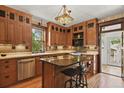 Spacious kitchen featuring wooden cabinets, granite countertops, and a center island at 2716 N Vine St, Denver, CO 80205