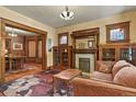 Elegant living room with hardwood floors, fireplace, and decorative stained glass windows at 2716 N Vine St, Denver, CO 80205