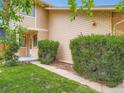 Charming home with a well-manicured lawn, mature bushes and traditional design elements at 4032 S Atchison Way, Aurora, CO 80014