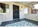 Inviting front porch with decorative rug and wreath, offering a warm welcome at 3336 N Saint Paul St, Denver, CO 80205
