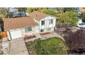Aerial view of a charming home with mature trees in the front yard at 1509 S Lewiston St, Aurora, CO 80017