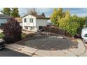 Charming two-story home with nice front yard landscaping at 1509 S Lewiston St, Aurora, CO 80017