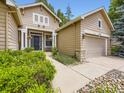Inviting home featuring a well-manicured walkway leading to the front door and attached garage at 10050 Eagle Valley Way, Highlands Ranch, CO 80129
