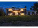 Brick ranch house with a large yard at night at 12626 N 1St St, Parker, CO 80134