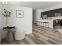 A modern kitchen seamlessly connected with the dining area, perfect for entertaining, offers abundant countertop space at 12547 Lake View St, Longmont, CO 80504