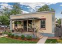 Charming front porch with twin address featuring a well-manicured lawn and colorful facade at 4528 W 34Th Ave, Denver, CO 80212