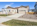 Attractive two-story house with a three-car garage and nicely landscaped yard at 3816 N Elk St, Aurora, CO 80019