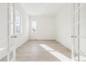 Bright and airy home office with hardwood floors and french doors at 3816 N Elk St, Aurora, CO 80019