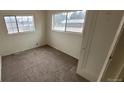 Bright bedroom with two windows, neutral carpet and baseboard trim at 3607 W 80Th Ave, Westminster, CO 80030