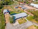 Expansive aerial view of a lovely home and property showcasing the spacious lot and outbuildings at 14347 E 134Th Ave, Brighton, CO 80601