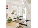 Bright foyer with light wood floors, art display, and natural light at 1884 S Ivy St, Denver, CO 80224