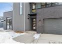 Contemporary home's front entrance with sleek design and gray accents at 3289 S Eudora St, Denver, CO 80222