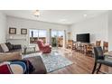 Bright living room with sliding glass doors and comfortable seating area at 14700 E 104Th Ave # 805, Commerce City, CO 80022