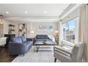 Bright living room boasts comfortable seating, natural light, and stylish accents, ideal for relaxation and gatherings at 2624 N Clay St, Denver, CO 80211