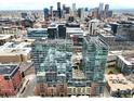 Stunning aerial view of modern building with city skyline backdrop, showcasing urban living at 1700 Bassett St # 314, Denver, CO 80202