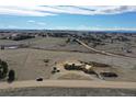 Aerial view of the homesite with views of surrounding landscape, including trees, roads, and other houses at 1286 Lisbon Dr, Parker, CO 80138