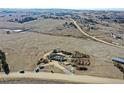 Aerial view of a construction project site shows a house foundation on a vast plot of land at 1286 Lisbon Dr, Parker, CO 80138