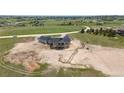 Aerial view of new construction home on a large lot with mountain views at 1286 Lisbon Dr, Parker, CO 80138