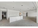 Unfinished living room featuring a stairway and recessed lighting throughout at 1286 Lisbon Dr, Parker, CO 80138