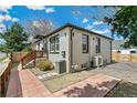 Well-maintained exterior with neutral paint and modern windows, offering a glimpse of outdoor living spaces at 2441 E 47Th Ave, Denver, CO 80216
