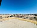 Expansive backyard with a concrete patio area, offering a great space for entertaining at 15454 W Auburn Ave, Lakewood, CO 80228