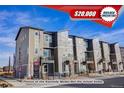 Modern townhome complex with attractive gray siding, balconies, and a $20,000 builder incentive at 2658 W 68Th Ave, Denver, CO 80221